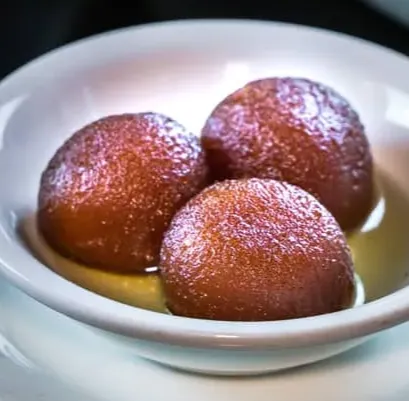 Gulab jamun dessert at Saanjh 24-7 Restaurant in Winnipeg, MB