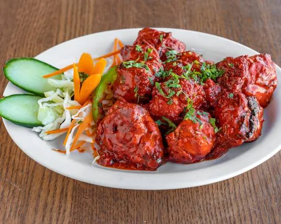 Tandoori Chicken — clay-oven grilled marinated chicken at Saanjh 24-7 Restaurant Winnipeg